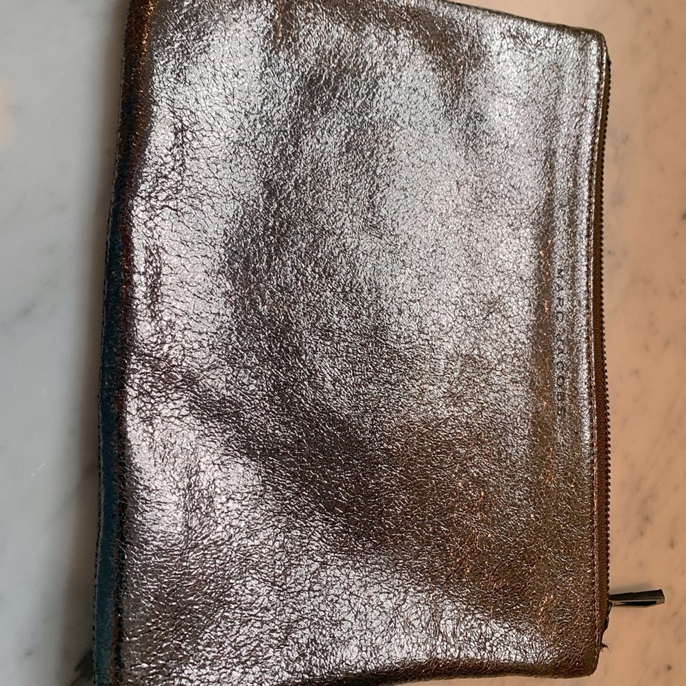 Marc Jacobs clutch. Bronze metallic. Zipper closure.